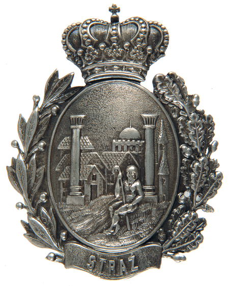 Odznaka
strażnika polowego – funkcjonariusza straży miasta Podgórza,
datowana na początek XX wieku. Choć w podgórskiej historii
przewijały się różne służby miejskie mające w nazwie „straż”, trwałą
i tradycyjnie posiadającą własne odznaki była straż polowa czuwająca
nad kompleksem spraw związanych z uprawami rolnymi, w tym przestrzeganiu
granic własności i bezpieczeństwa upraw (Muzeum Historyczne
Miasta Krakowa, nr inw. 4682/III)