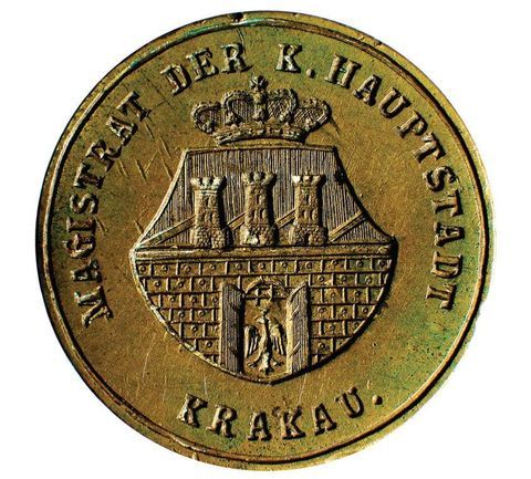 (023) Herb Krakowa na pieczęci Magistratu Królewskiego
Głównego Miasta Krakowa, powołanego w 1853 r. jako
główny organ władzy miejskiej po rozwiązaniu przez
władze austriackie Rady Miejskiej; na krótko urzędowym
językiem był wówczas niemiecki – tu zwierciadlane odbicie
stempla tej pieczęci (ANK, sygn. T 74)